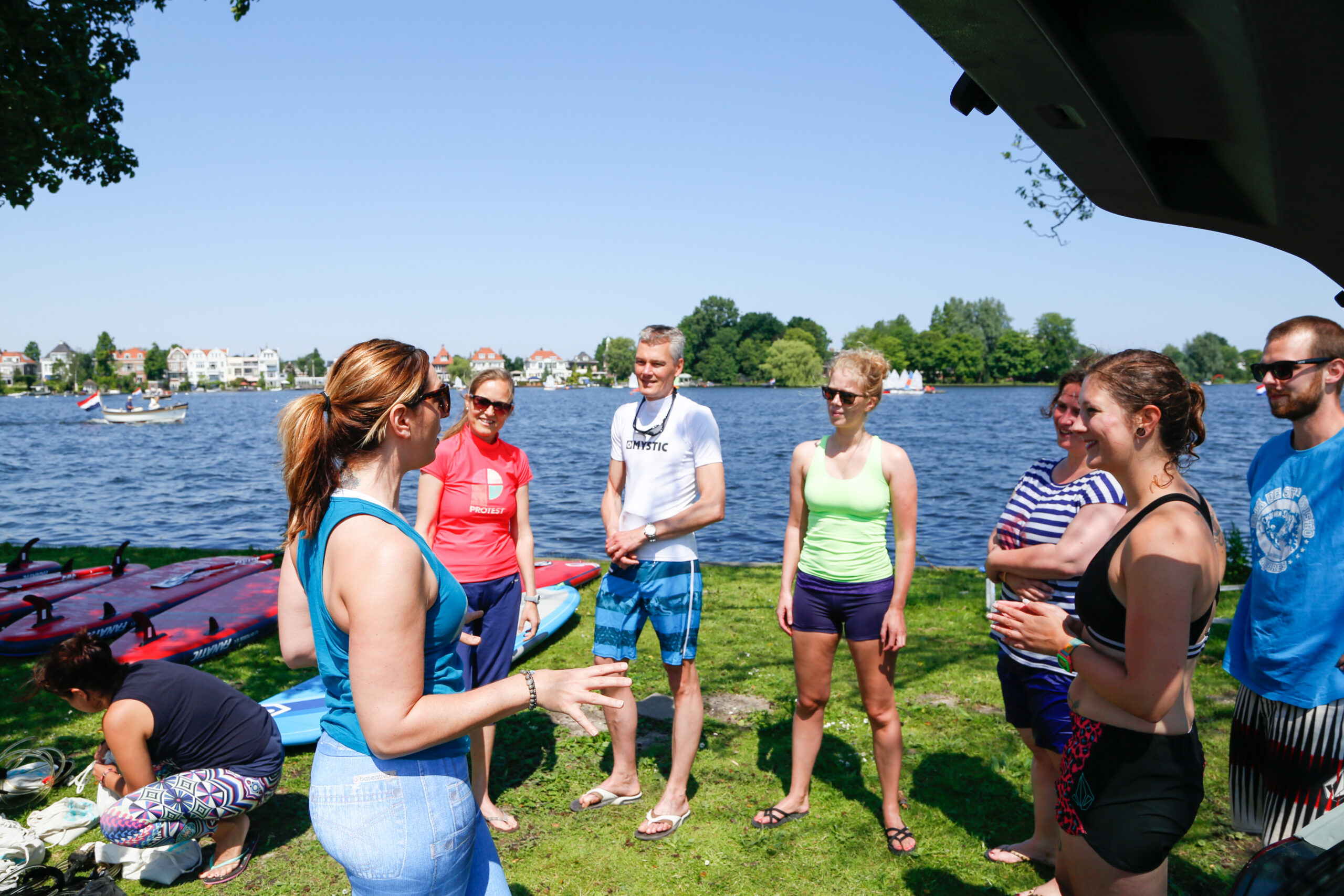 Paddle Performance Health coach Kristina Morros teaching a stand-up paddleboarding class in Rotterdam, Netherlands.